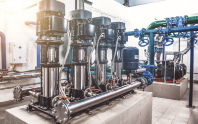 Industrial interior of water pump, valves, pressure gauges, motors inside engine room. Automatic control systems, Industry pumps in an technical room, urban modern powerful pipelines. Copy text space